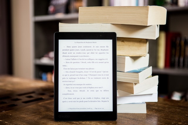 tablet and stack of books