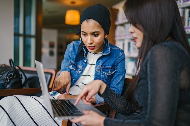 two women with laptop