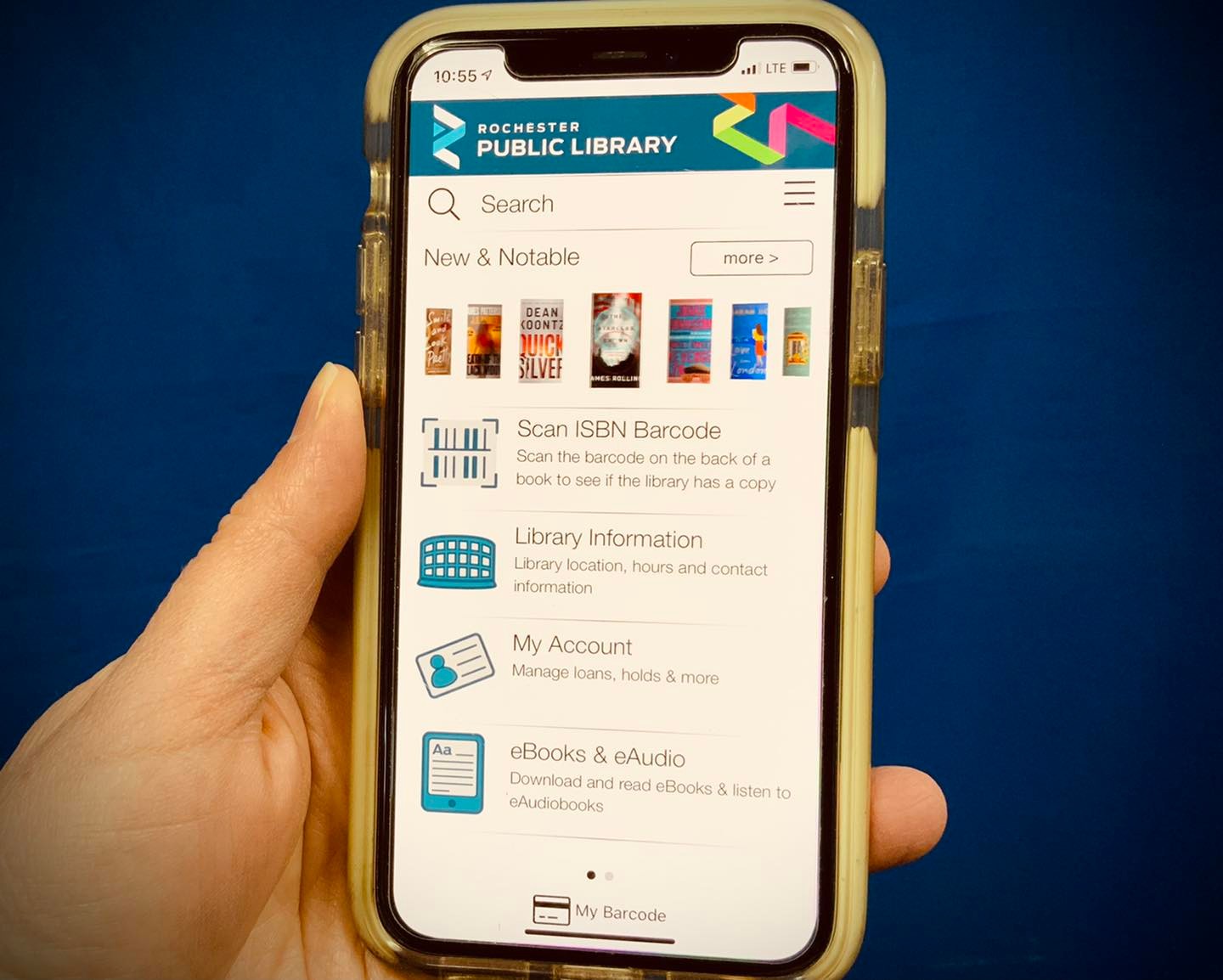 hand holding a phone with library app displayed