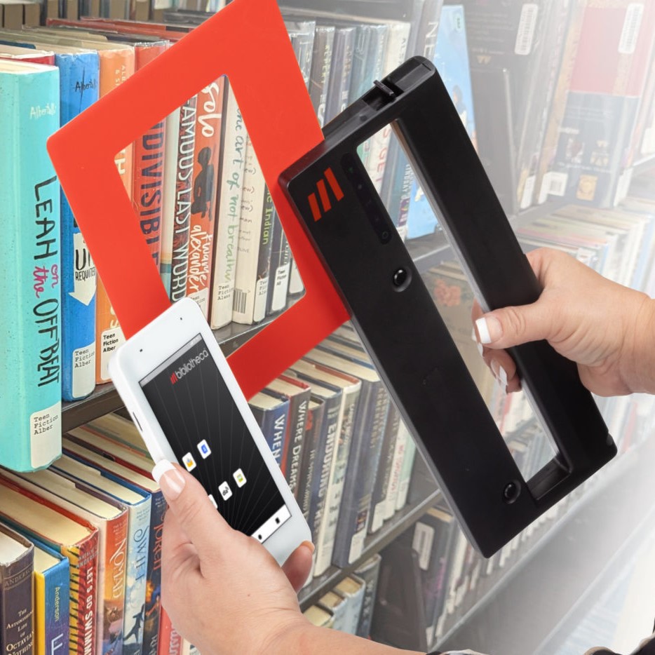 a person holding a phone and a book scanning device